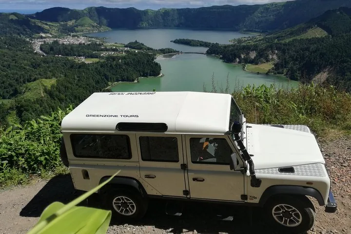 White Greenzone Tours jeep parked above the Sete Cidades twin lakes.